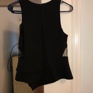 Asymmetrical Peplum blouse top black side cut outs